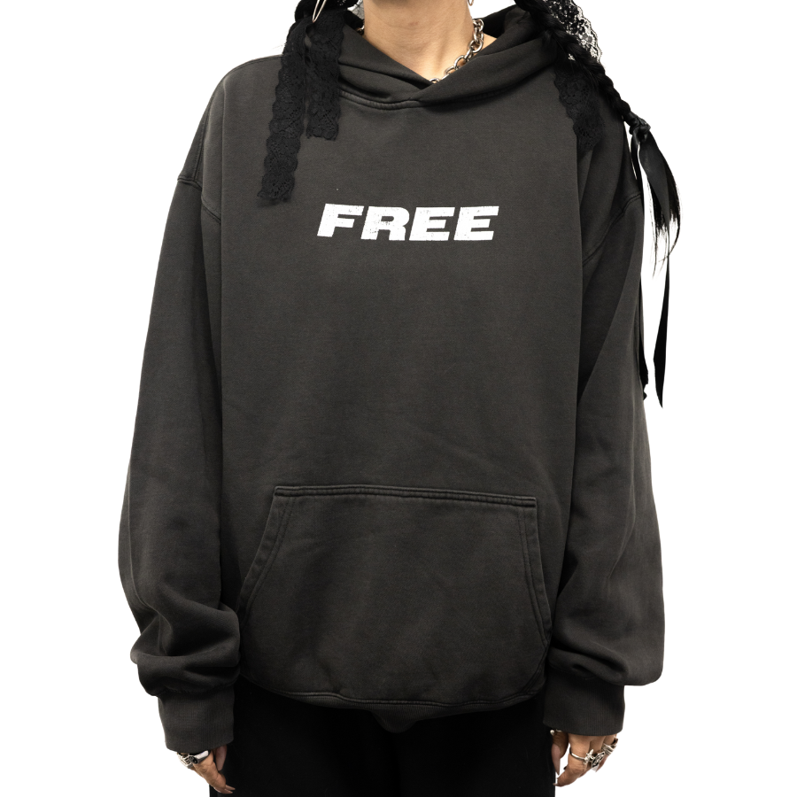 Black faded hoodie with white 'FREE' text on front, front pocket, relaxed fit