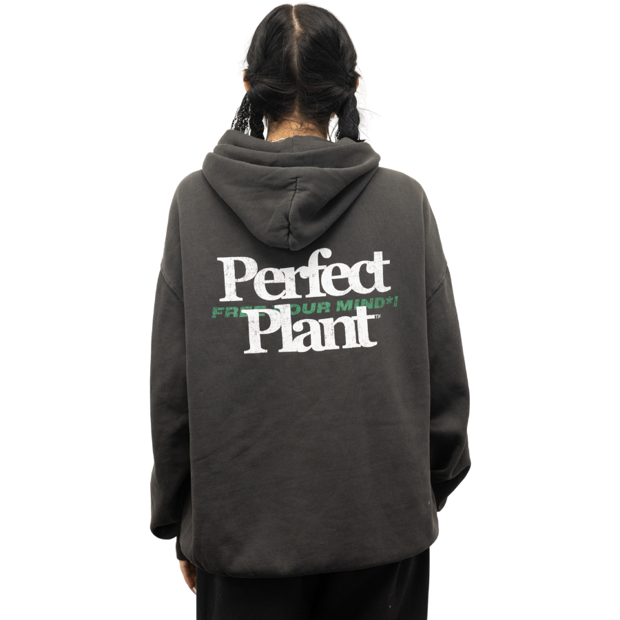Black hoodie with white "Perfect Plant" and green "Free Your Mind" text on back, worn by person