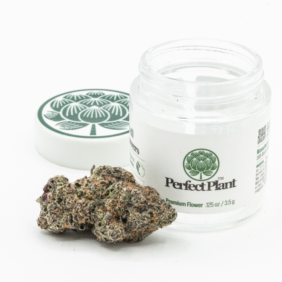 Grape Ape hemp flower bud next to an open jar with green label on a white background