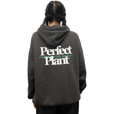 Black hoodie with white "Perfect Plant" and green "Free Your Mind" text on back, worn by person