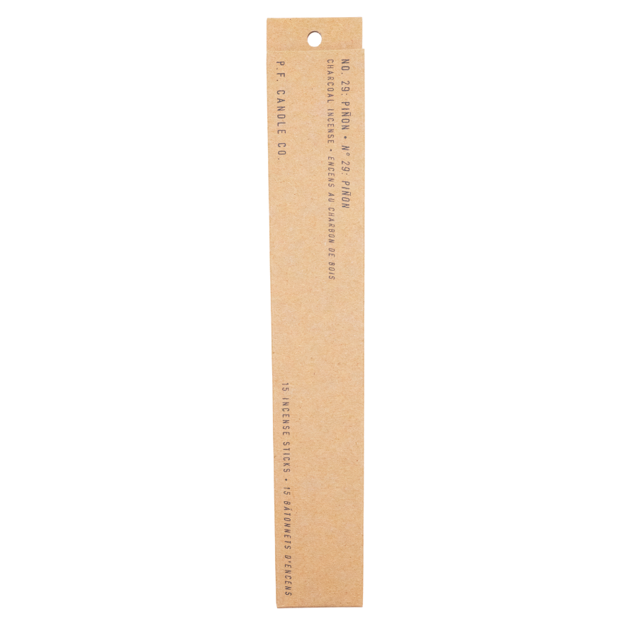 Minimalist brown packaging for Piñon scented incense sticks, showing product details.