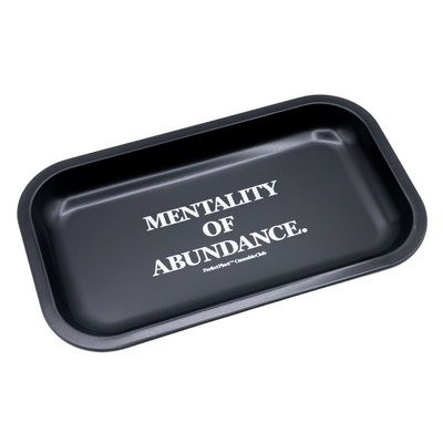 Black rolling tray with 'Mentality of Abundance' printed in white text, metal accessory.